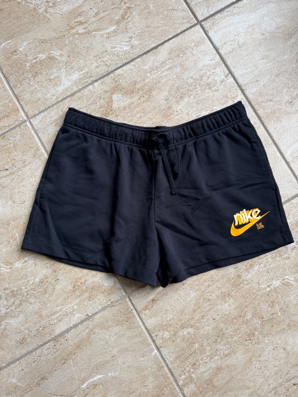Nike Black Women's Athletic Shorts with Gold Swoosh